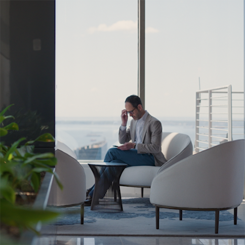 Two colleagues discussing work at a desk